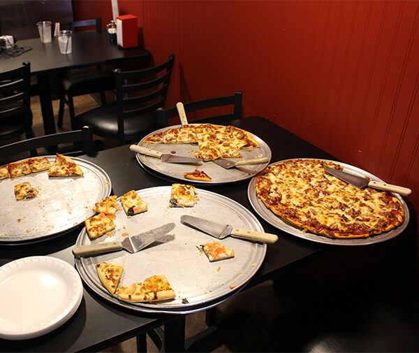Image of trays of pizzas at Sal's Pizza Place in Huntley Illinois
