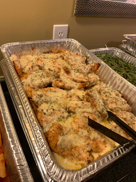 Baked chicken catering dish by Sal's Pizza Place